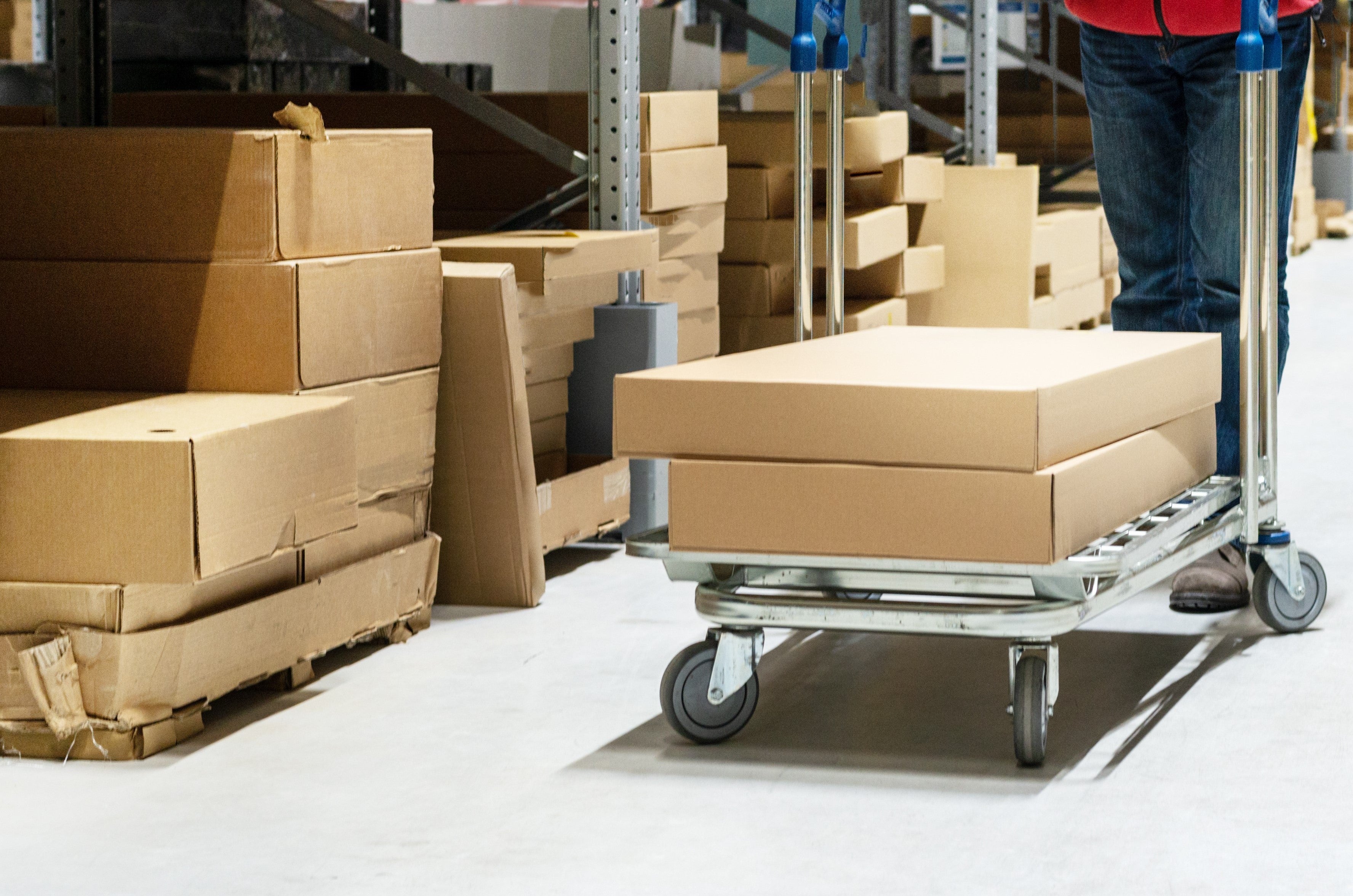 Boxes on trolley in fulfillment warehouse